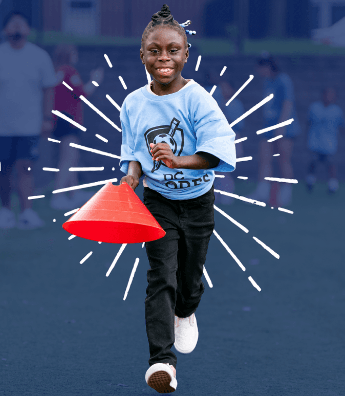Smiling woman giving a piggyback ride to a laughing young girl.